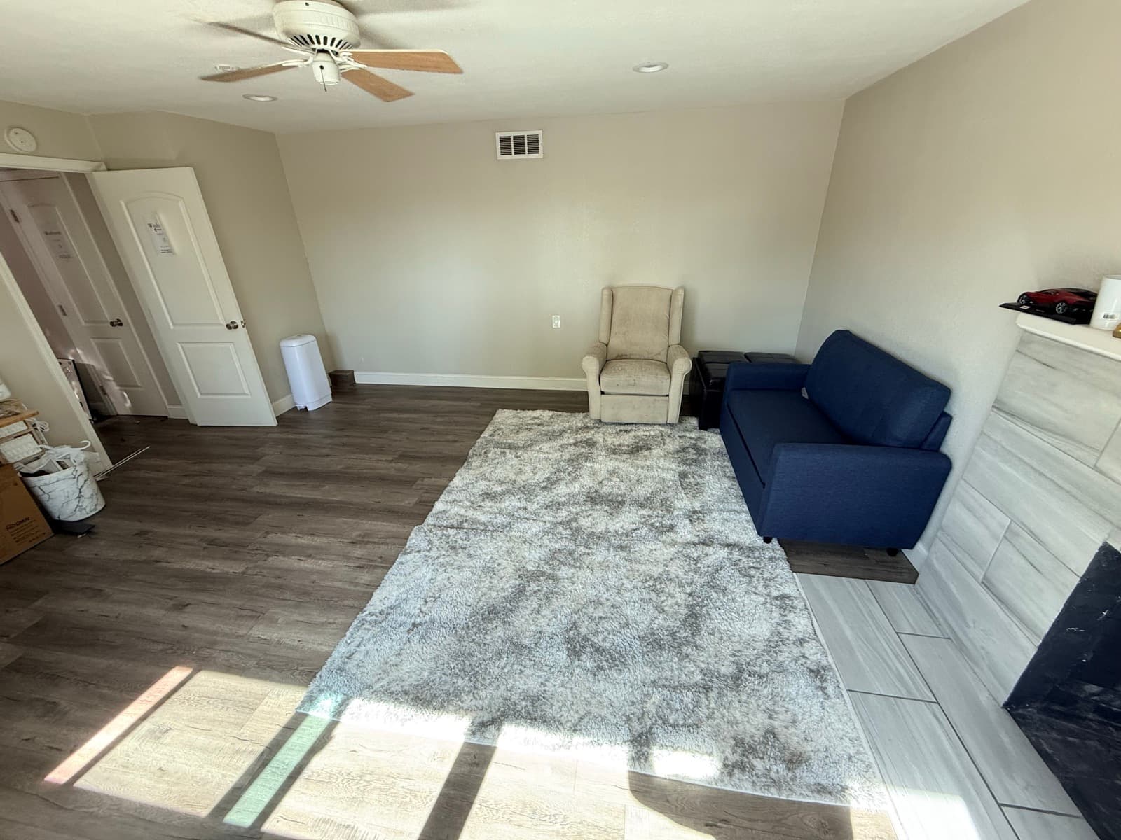 Living room after (alternate angle): clear, calm, and inviting