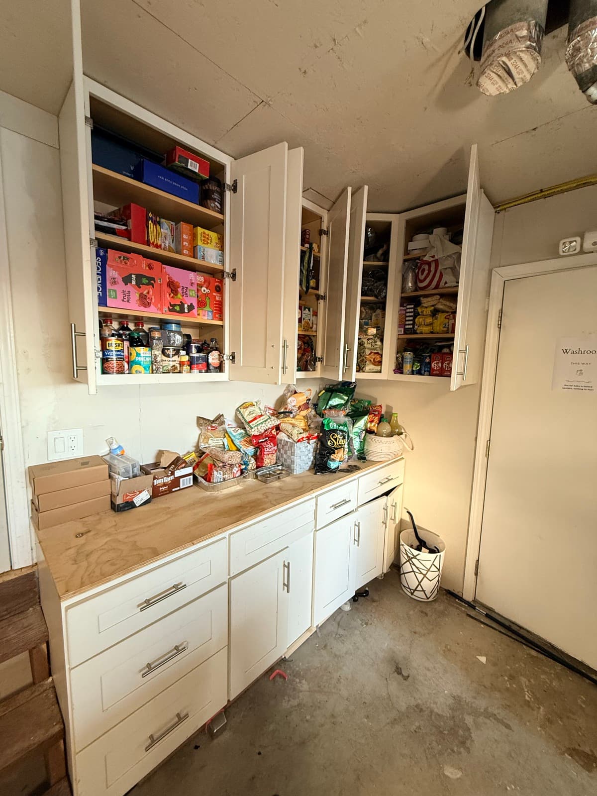 Pantry after: organized cabinets, clear counter, every item in its place
