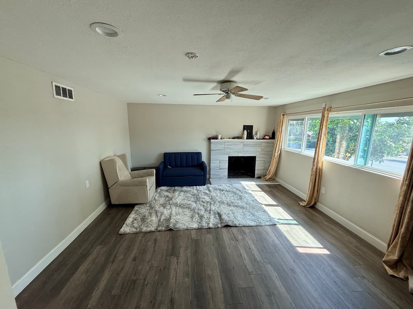 Living room after: completely clear and beautiful with hardwood floors