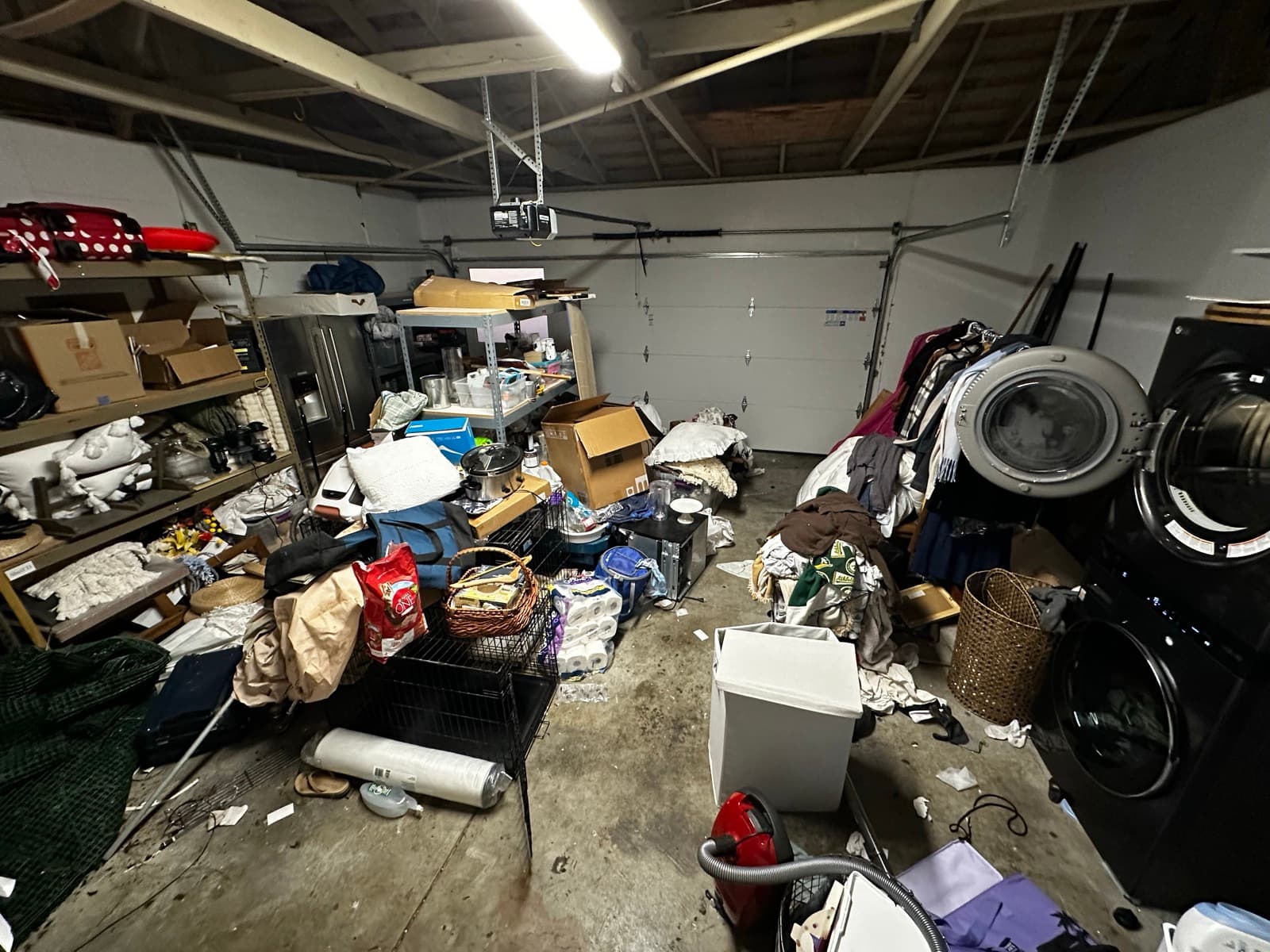 Garage before: cluttered floor-to-ceiling with no usable space